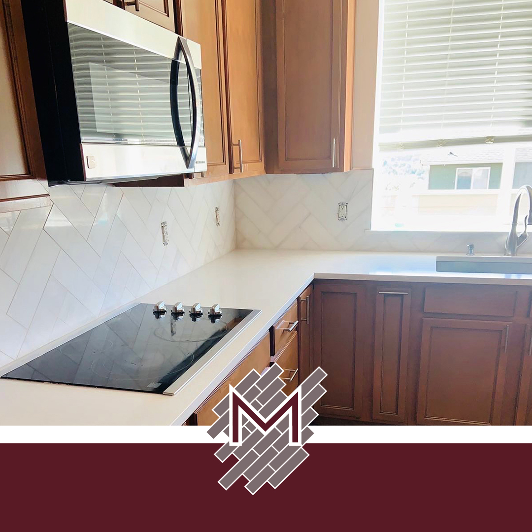 Herringbone backsplash tile and fireplace